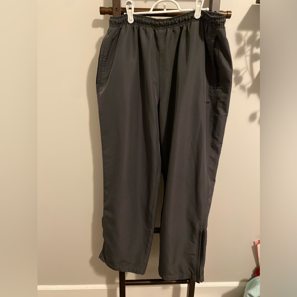 REEBOK WIND PANT WITH LEG ZIP